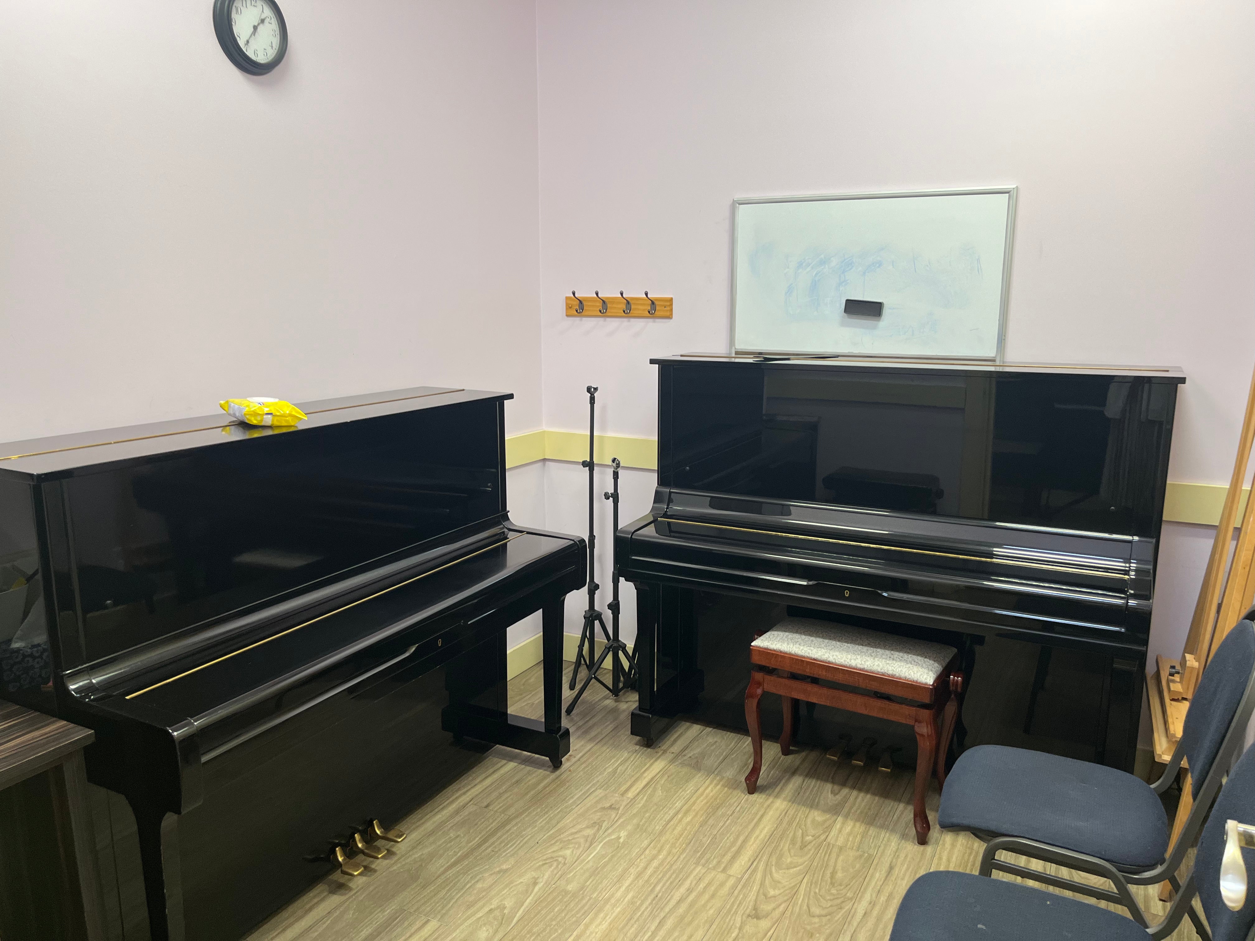 two pianos in a room