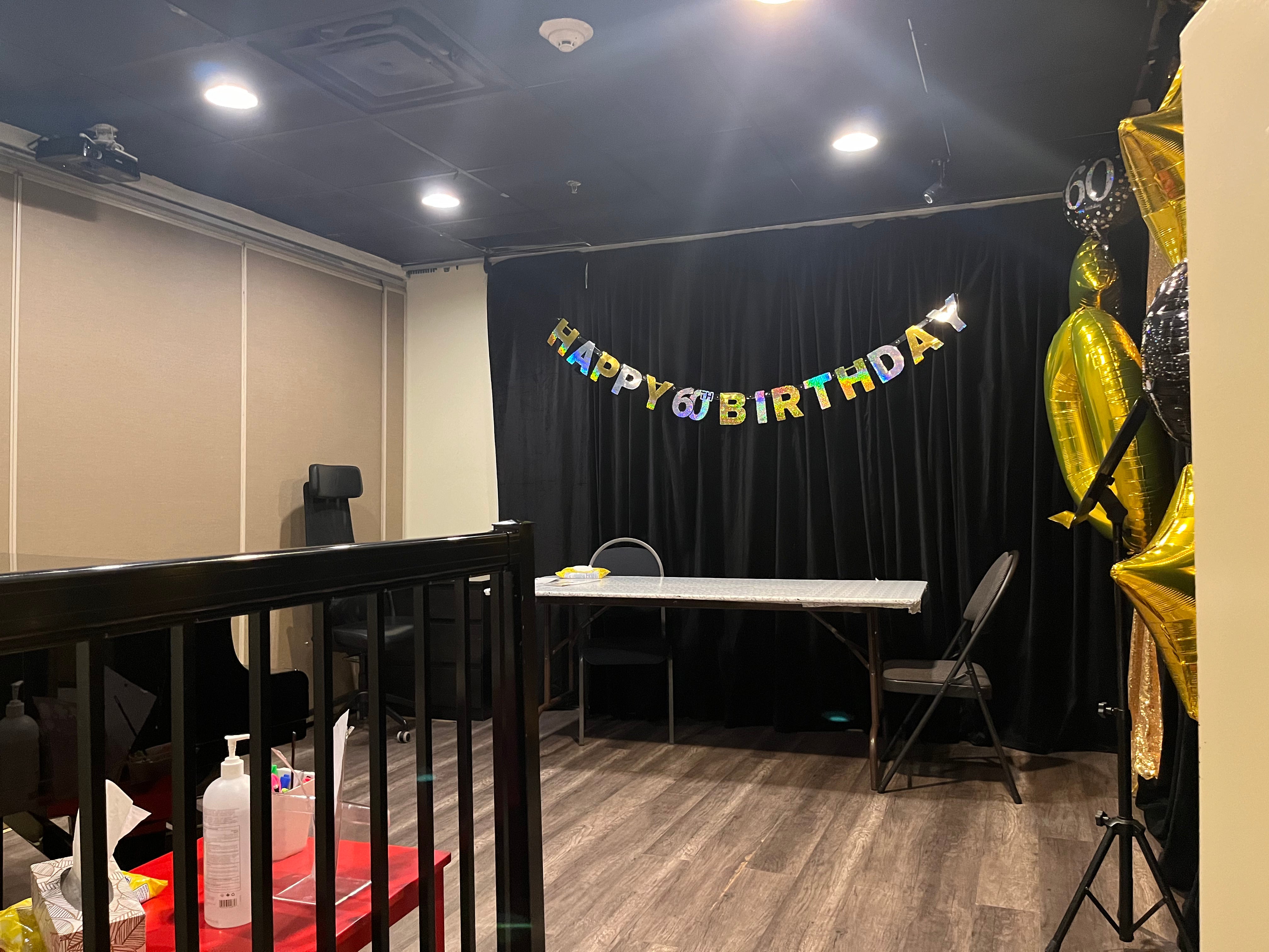 a happy birthday banner being hung