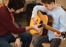 Load image into Gallery viewer, An image of a    Guitar &amp; Bass Lessons by AvaMusic

