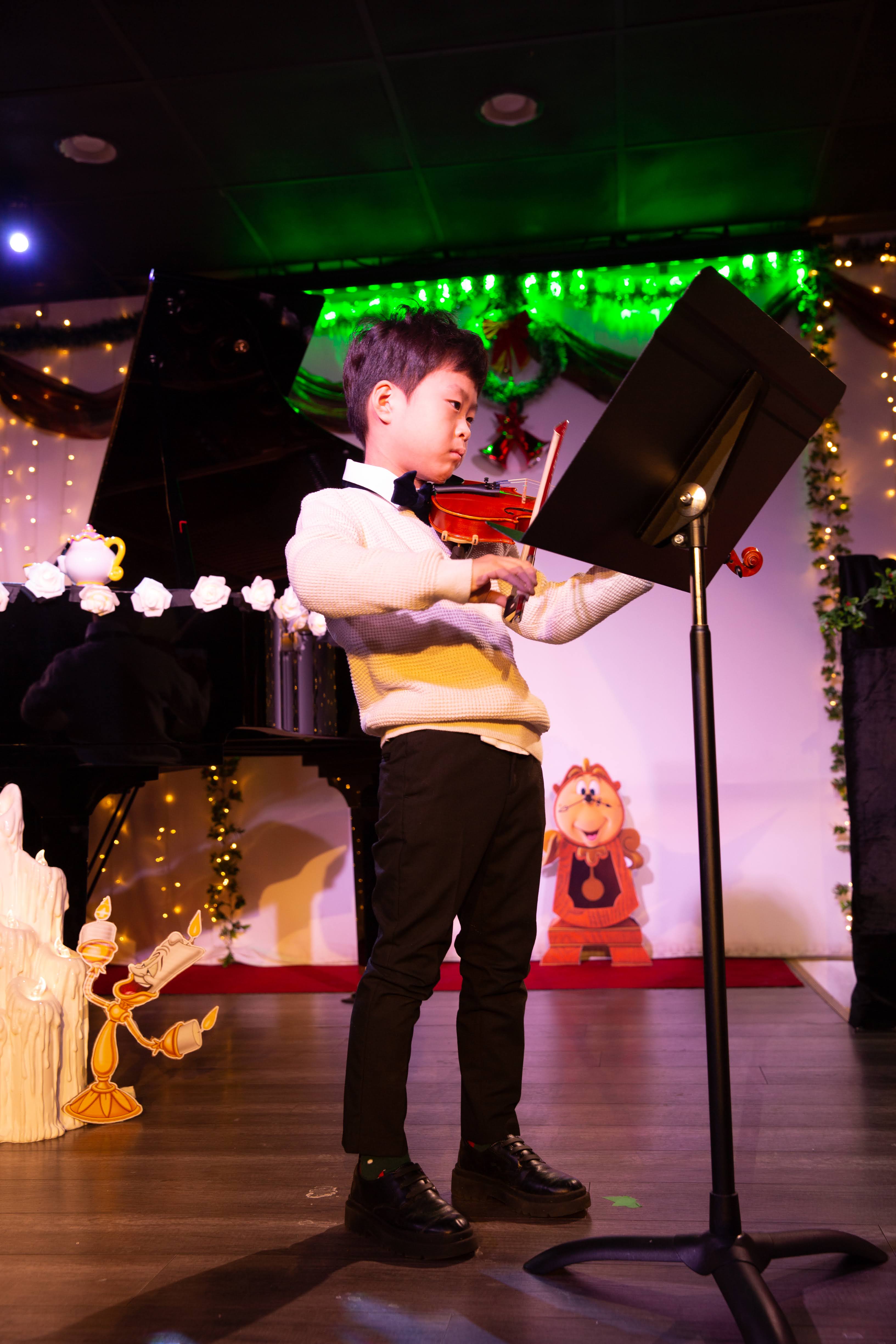 young kid becoming a violin master