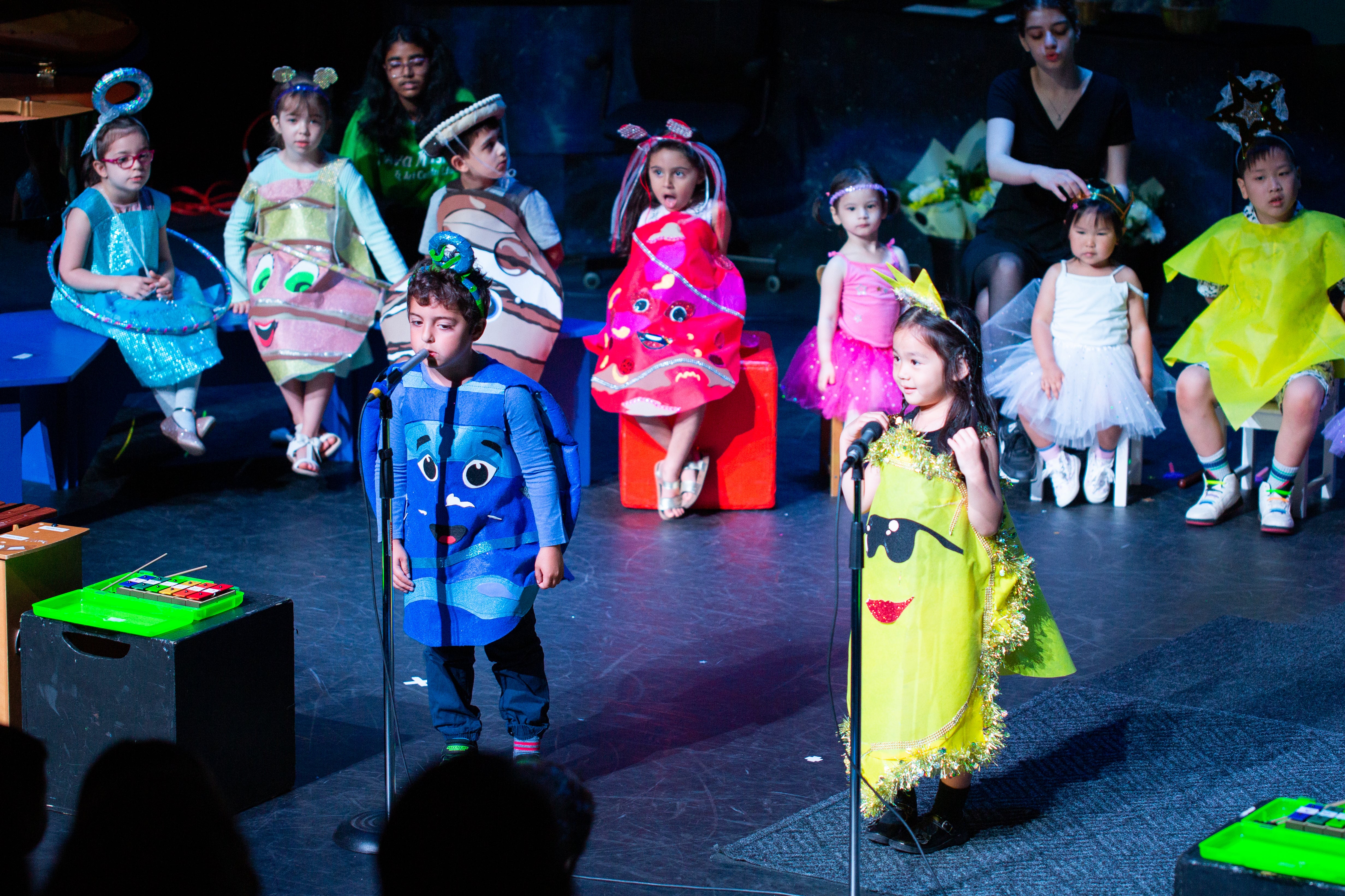 the kids enjoying their play at the stage