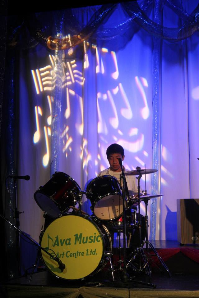 child playing drums