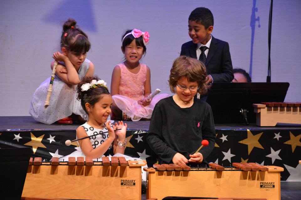 kids enjoying two xylophones