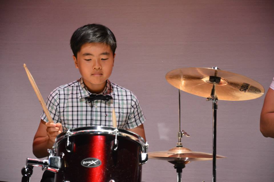 a master kid and his drums