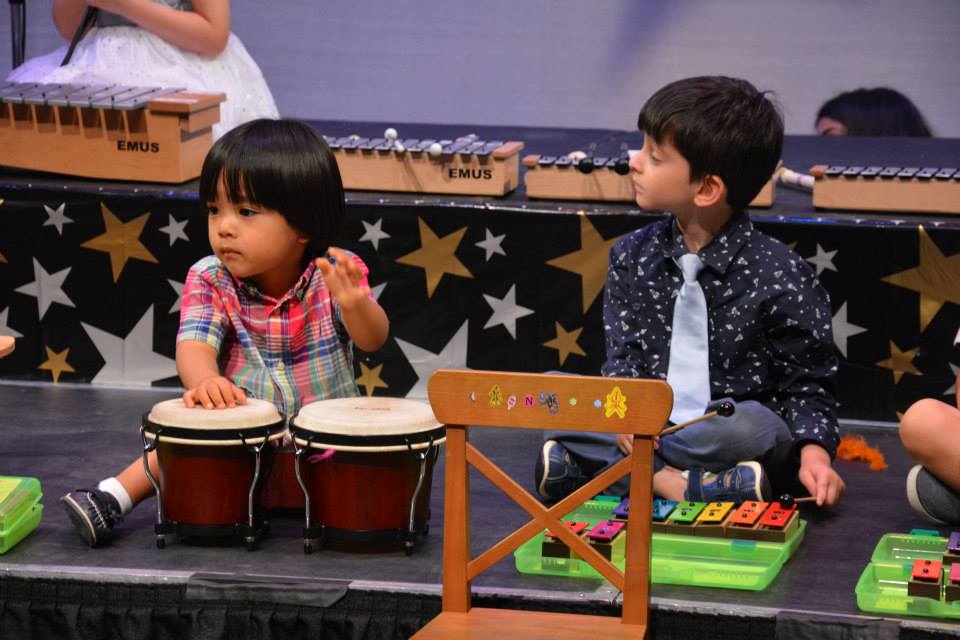 young kids playing instruments