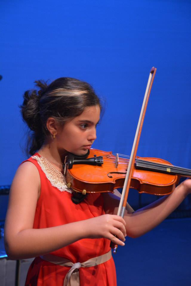 beautiful girl playing the violin