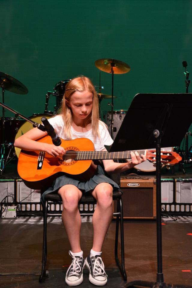 girl playing guitar