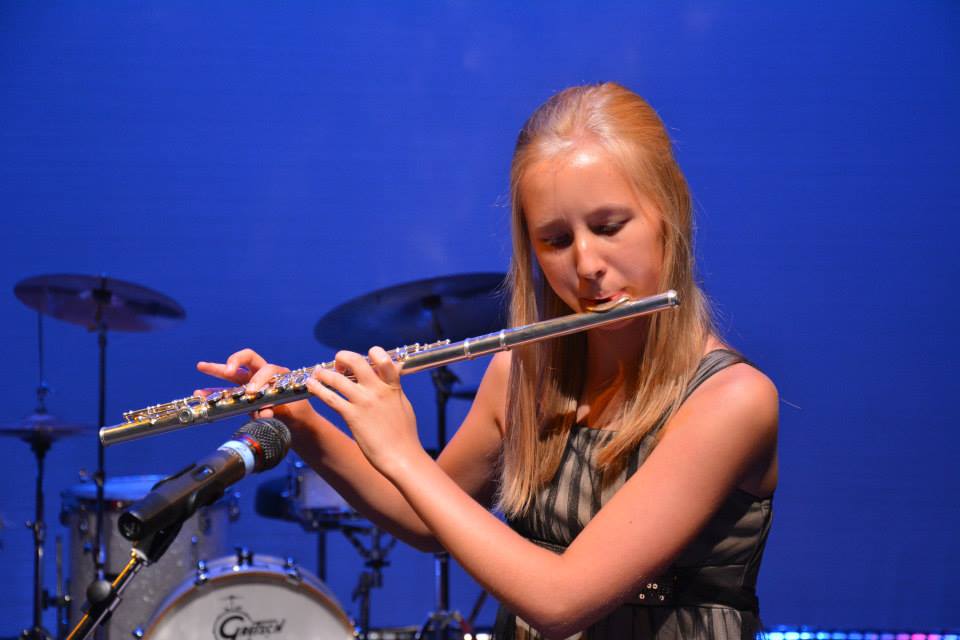 a girl playing the flute