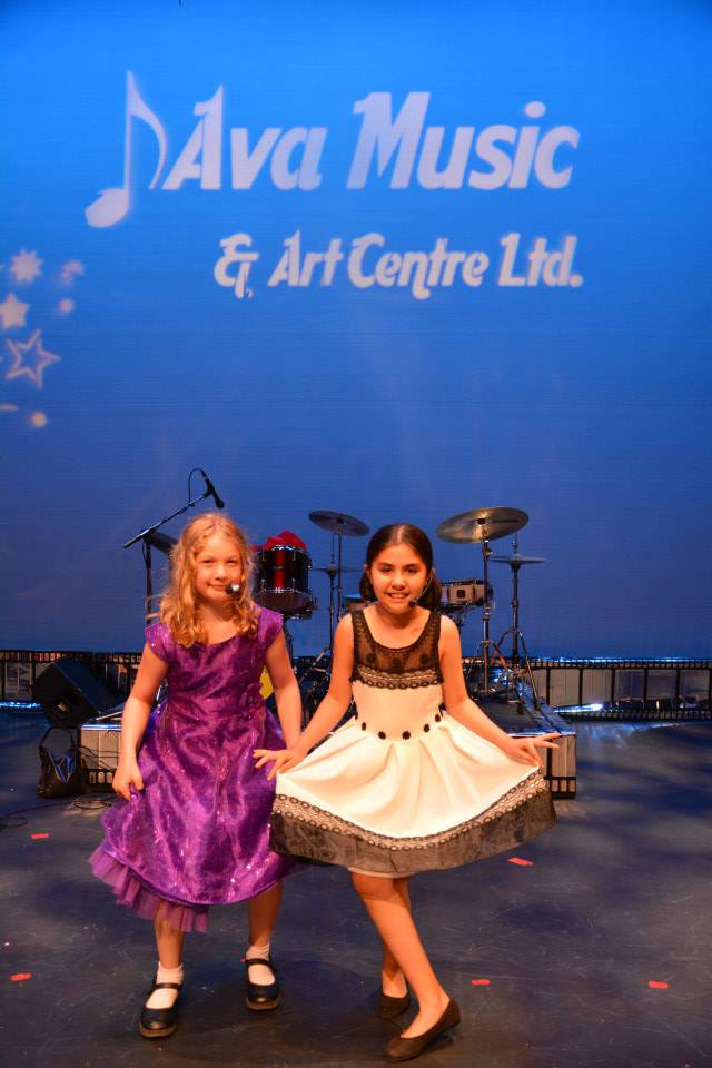 two girls applauded after their performance