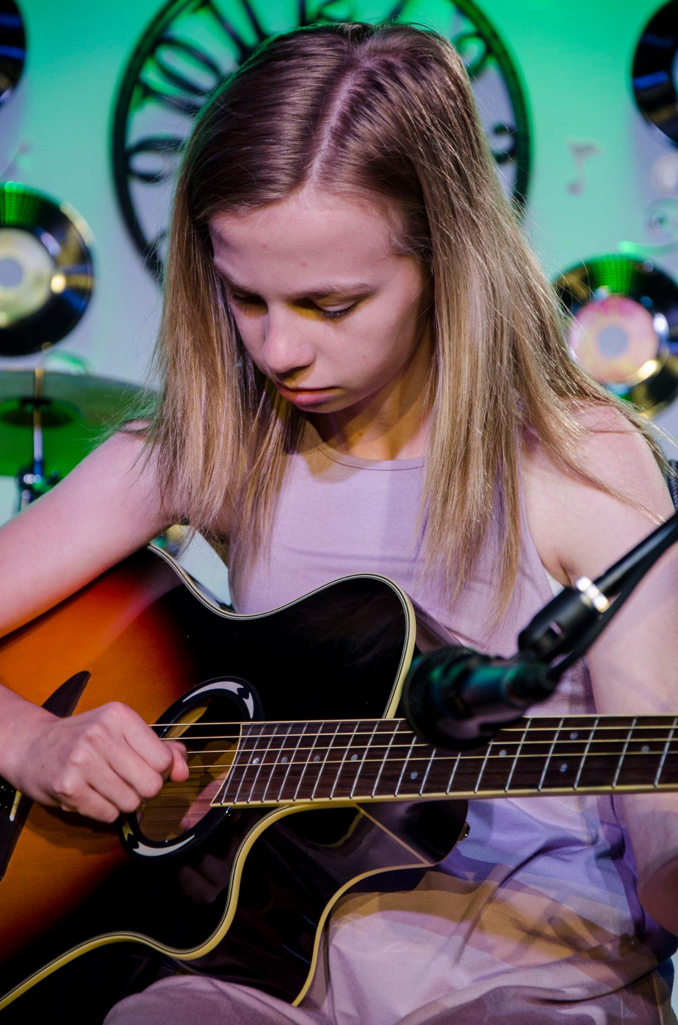 girl plucking the guitar