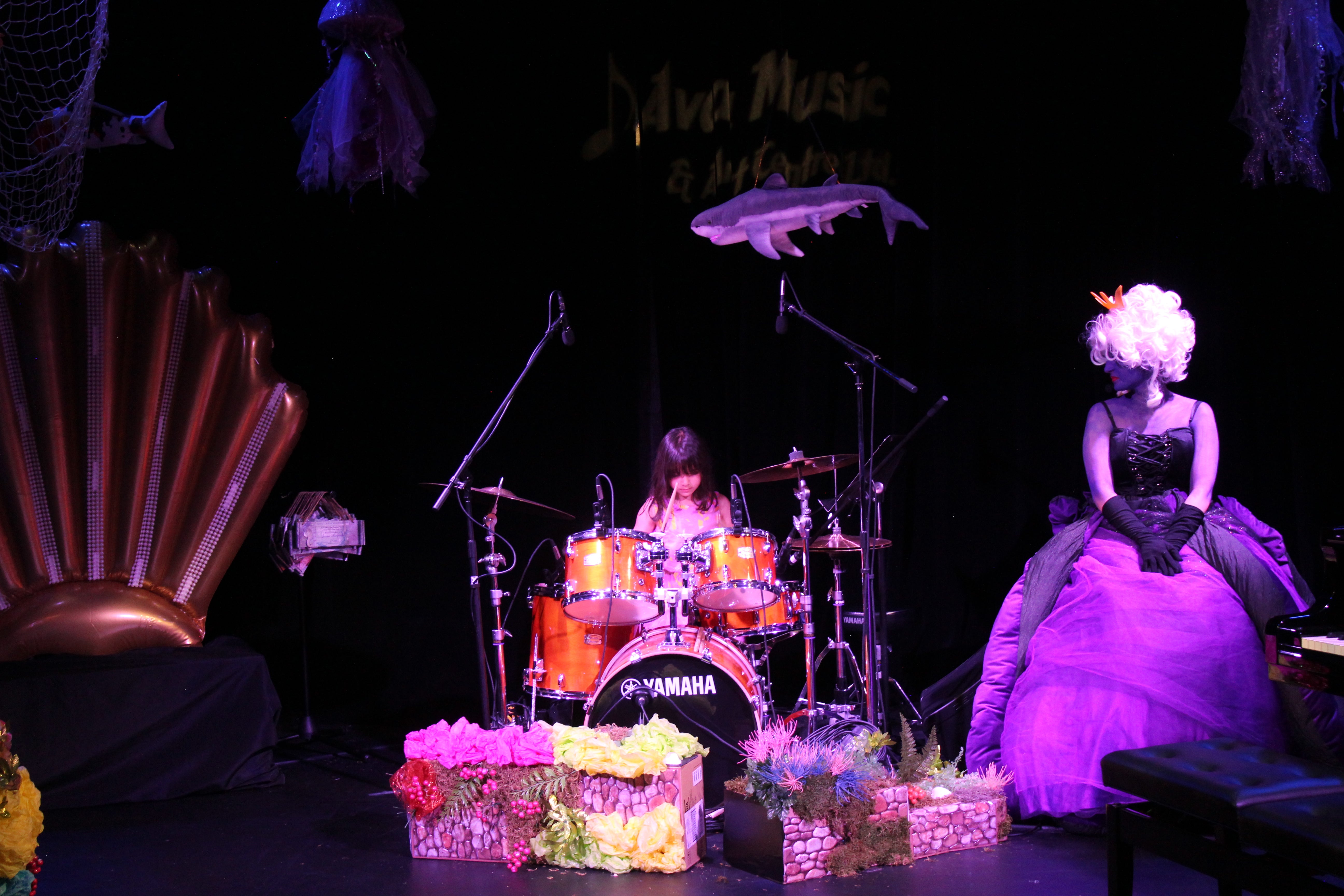 a kid mastering the drum set