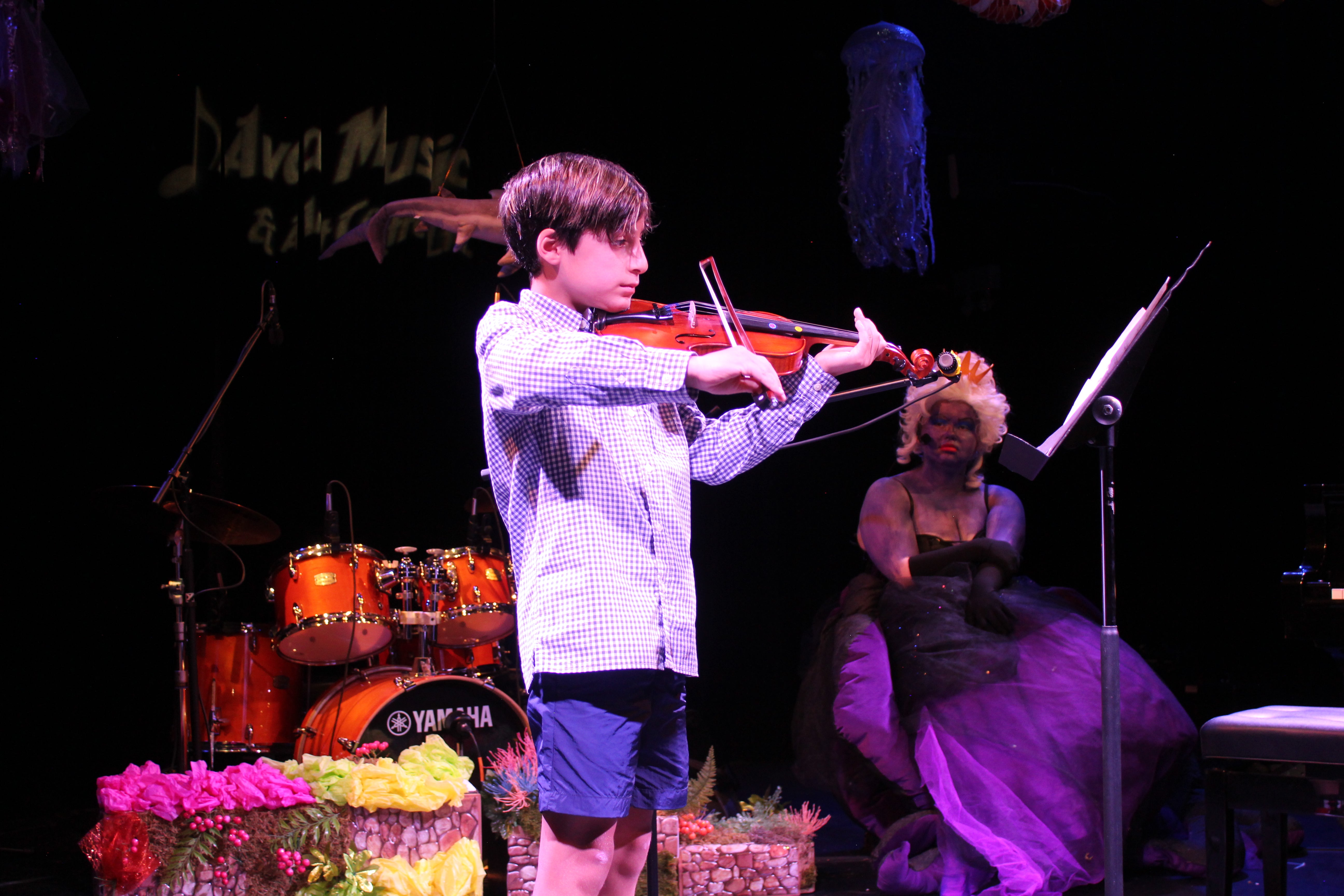 the boy is a master at the violin