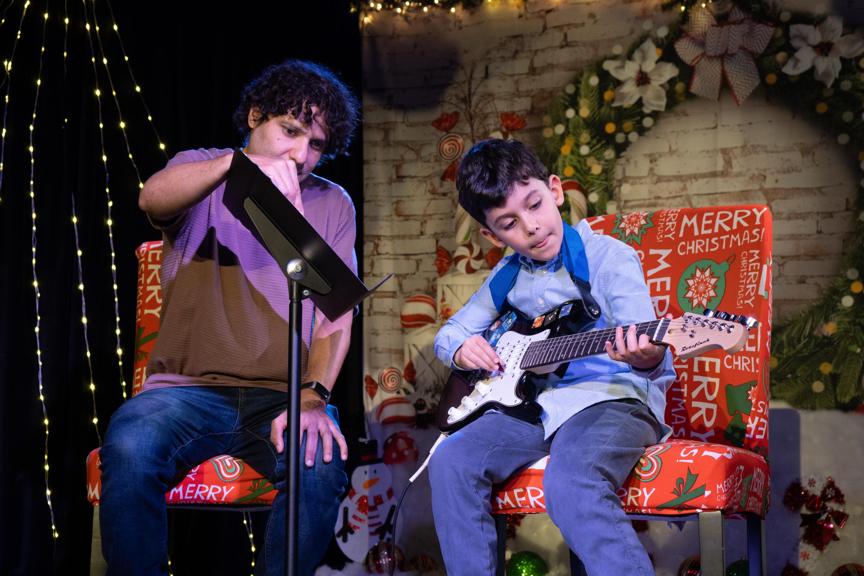 Young musicians' guitar recital during winter festival