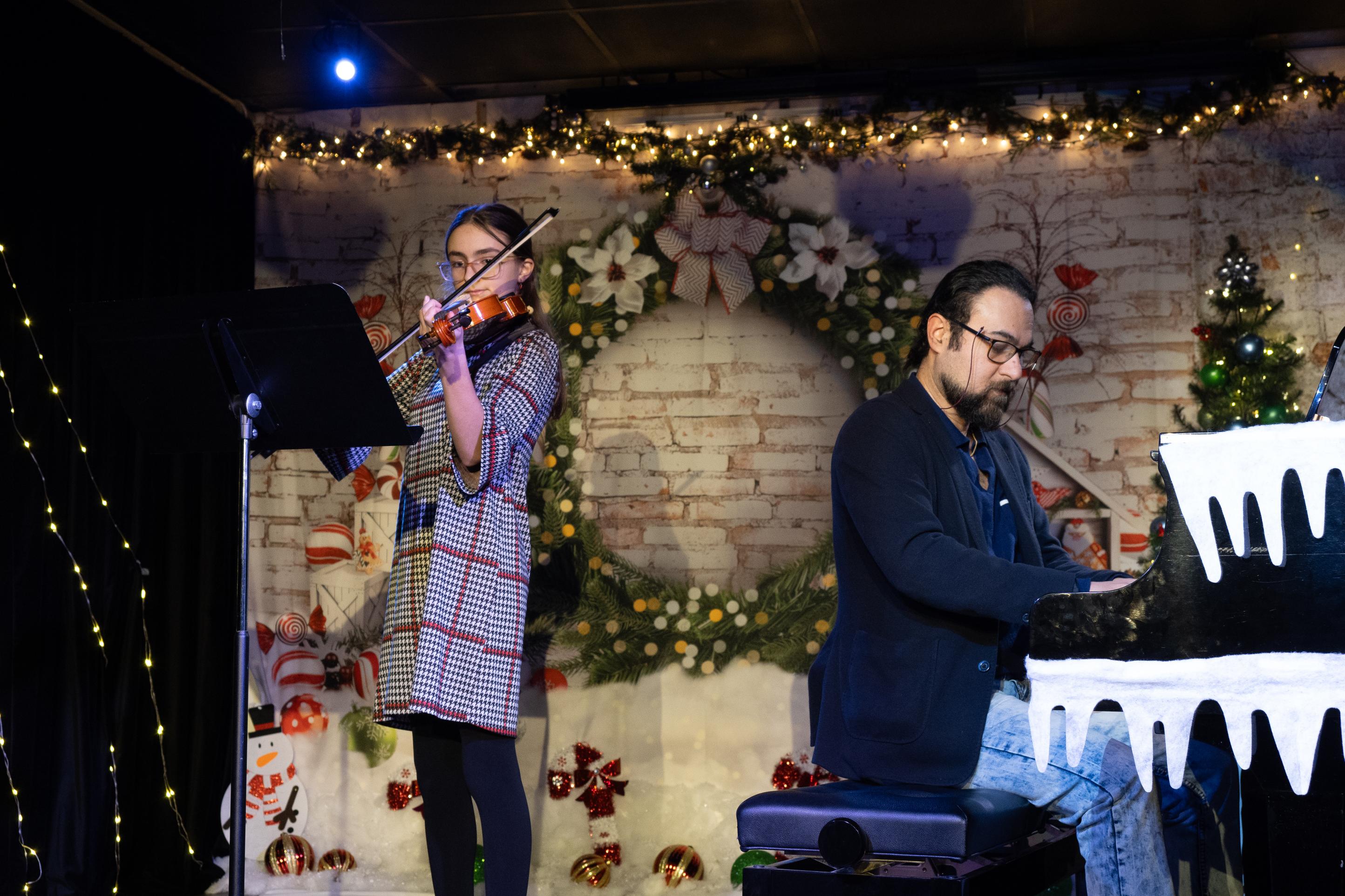 Enchanting violin and piano duet in a live performance