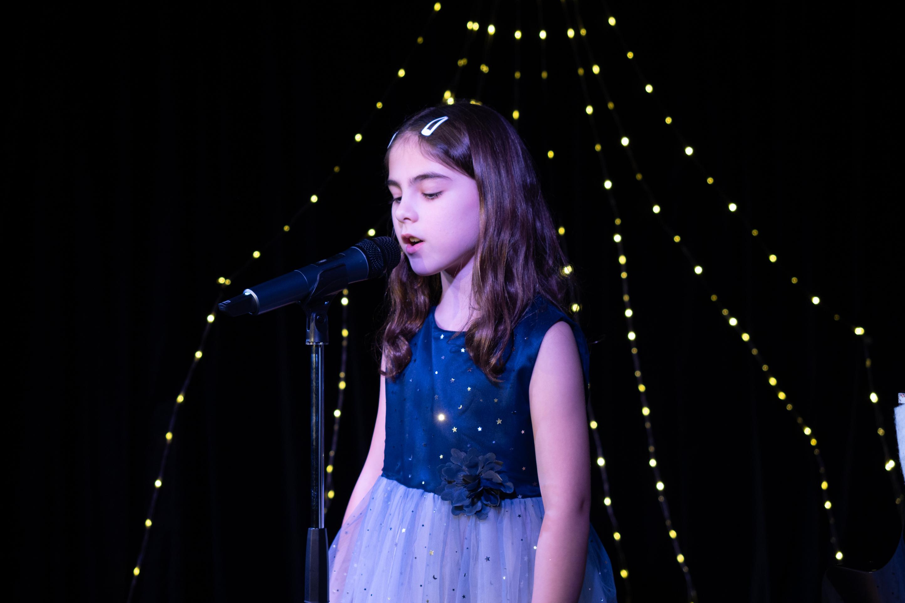 Heartwarming child singing with pure joy