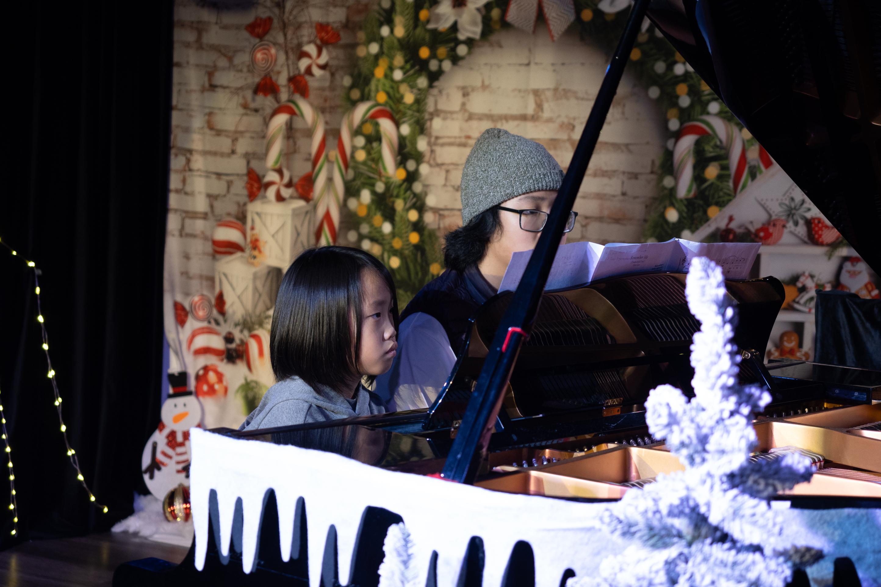 Kids playing piano in holiday concert